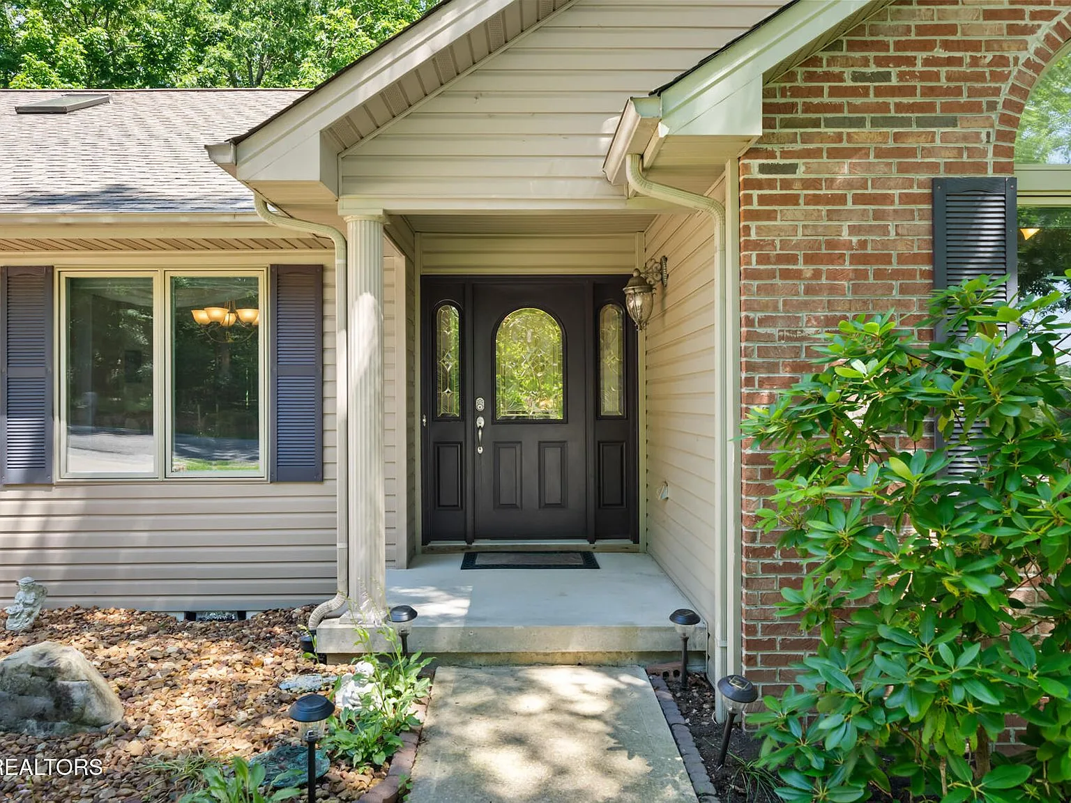 Custom front door with beveled-glass sidelights